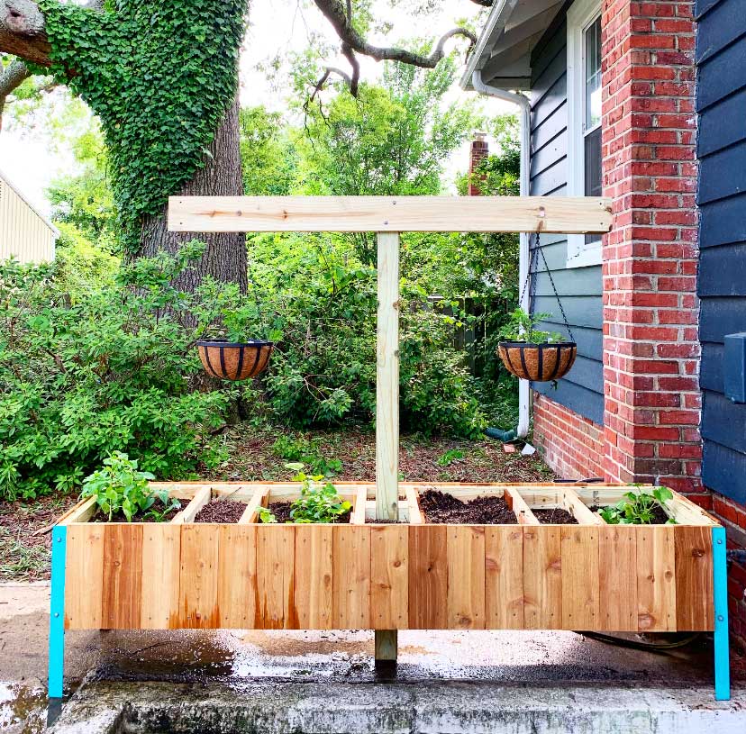 Image of Raised garden bed with compost bin